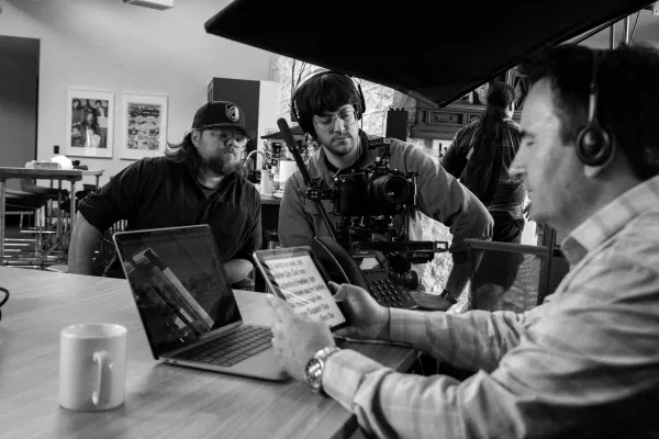 The Clix crew reviewing footage together at video village